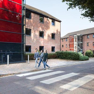 Students walking through Elm's Village